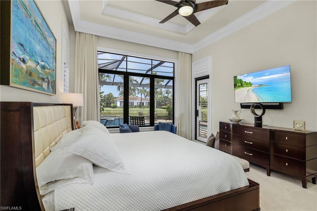 2220 Residence Circle Naples, FL 34105 - Photo 19 of 50 Carpeted bedroom featuring a sunroom, access to exterior, a raised ceiling, a ceiling fan, and ornamental molding