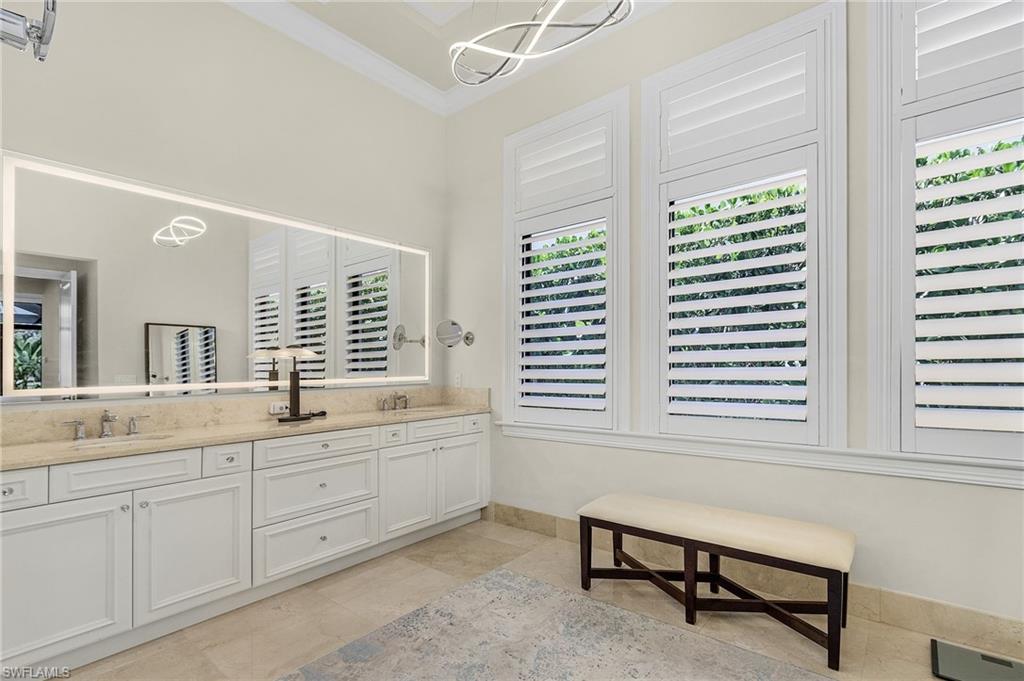 2220 Residence Circle Naples, FL 34105 - Photo 20 of 50 Bathroom featuring double vanity and crown molding