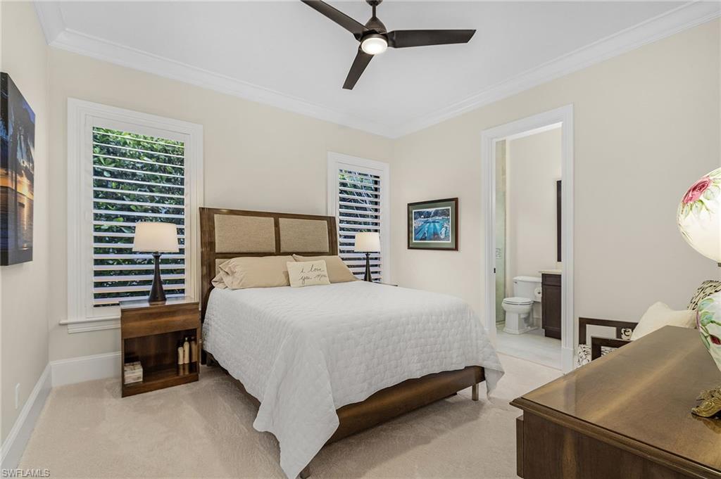 2220 Residence Circle Naples, FL 34105 - Photo 22 of 50 Bedroom with ornamental molding, light carpet, ceiling fan, and connected bathroom