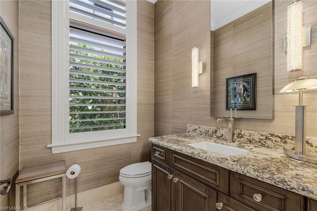 2220 Residence Circle Naples, FL 34105 - Photo 23 of 50 Bathroom featuring vanity and wallpapered walls