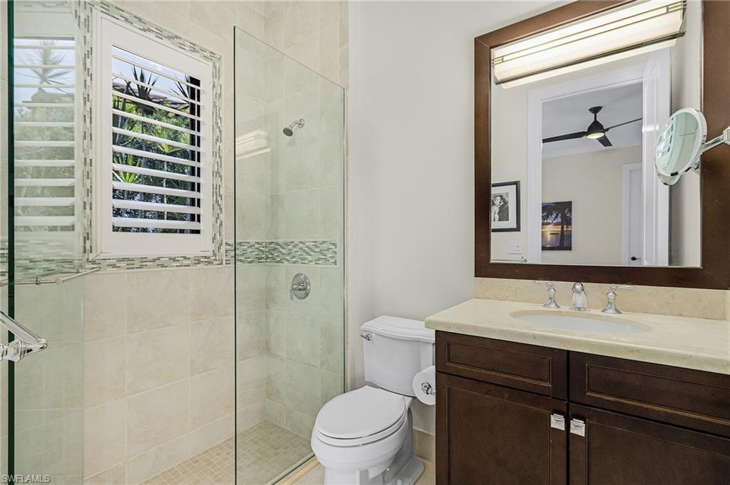 2220 Residence Circle Naples, FL 34105 - Photo 26 of 50 Full bathroom with a stall shower and vanity