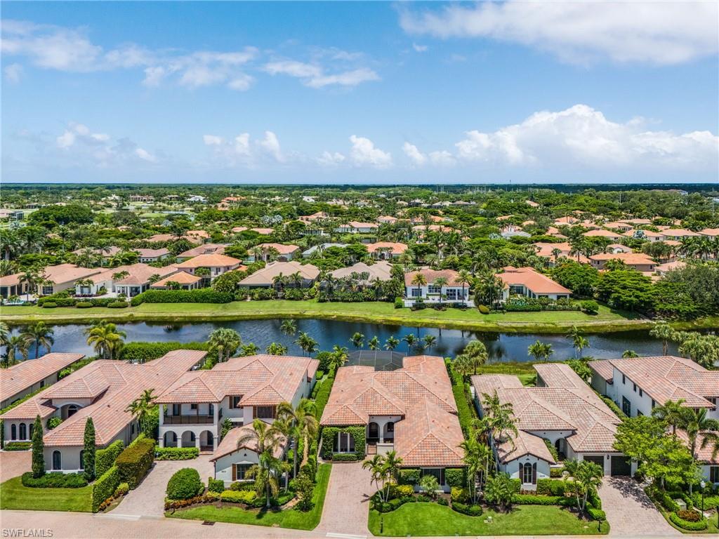 2220 Residence Circle Naples, FL 34105 - Photo 3 of 50 Aerial view of residential area featuring a large body of water