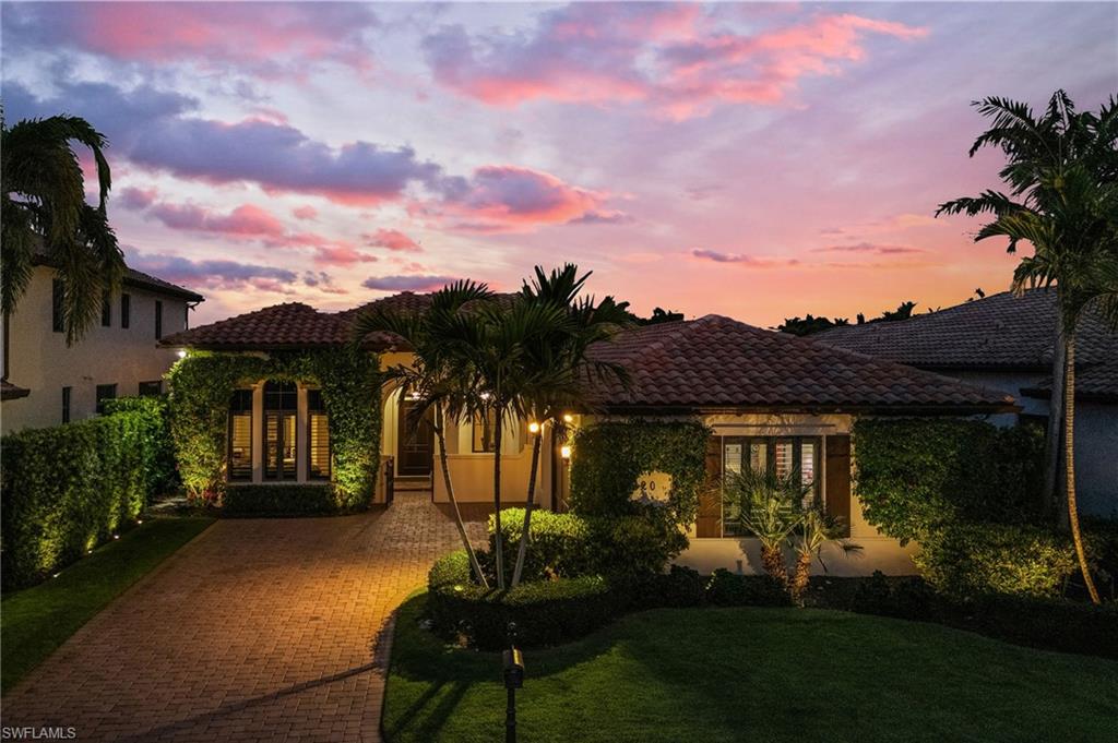 2220 Residence Circle Naples, FL 34105 - Photo 44 of 50 Mediterranean / spanish-style home with stucco siding, decorative driveway, a yard, and a tiled roof