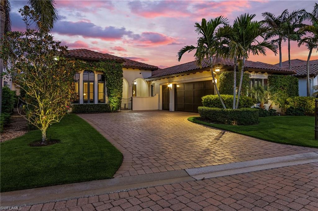 2220 Residence Circle Naples, FL 34105 - Photo 46 of 50 Mediterranean / spanish house with a front yard, a garage, a tile roof, stucco siding, and decorative driveway
