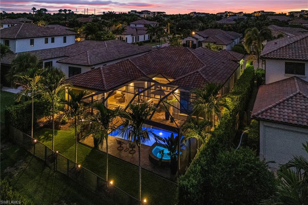 2220 Residence Circle Naples, FL 34105 - Photo 49 of 50 Aerial view at dusk of view of pool and a residential view