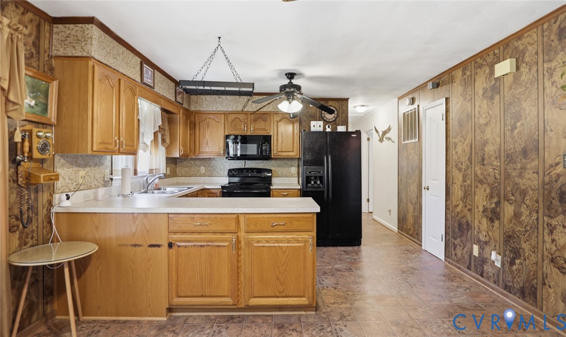 19353 Boulwares Road Ruther Glen, VA 22546 - Photo 23 of 62 Kitchen featuring black appliances, light countert