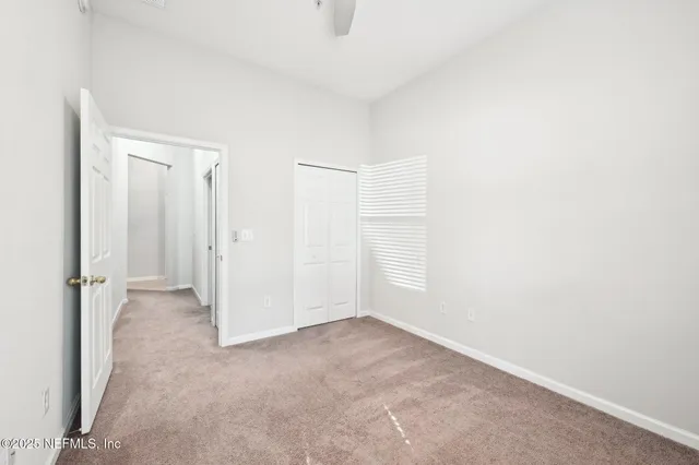 a view of a house with swimming pool and sitting area