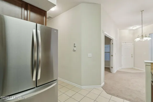 a view of a workspace with furniture and a bookshelf