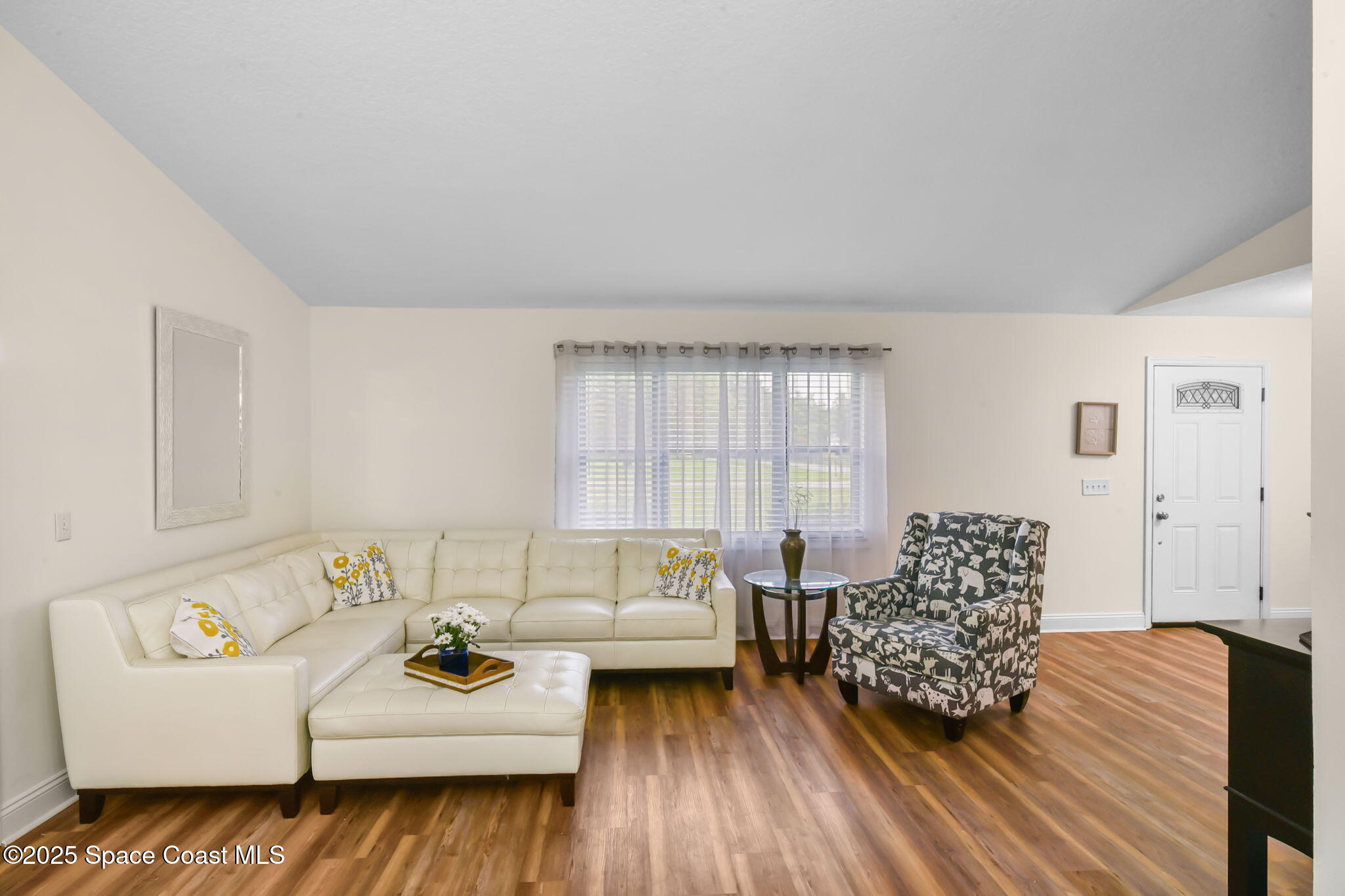 1873 Carrin Street Deltona, FL 32738 - Photo 11 of 54 a living room with furniture and wooden floor