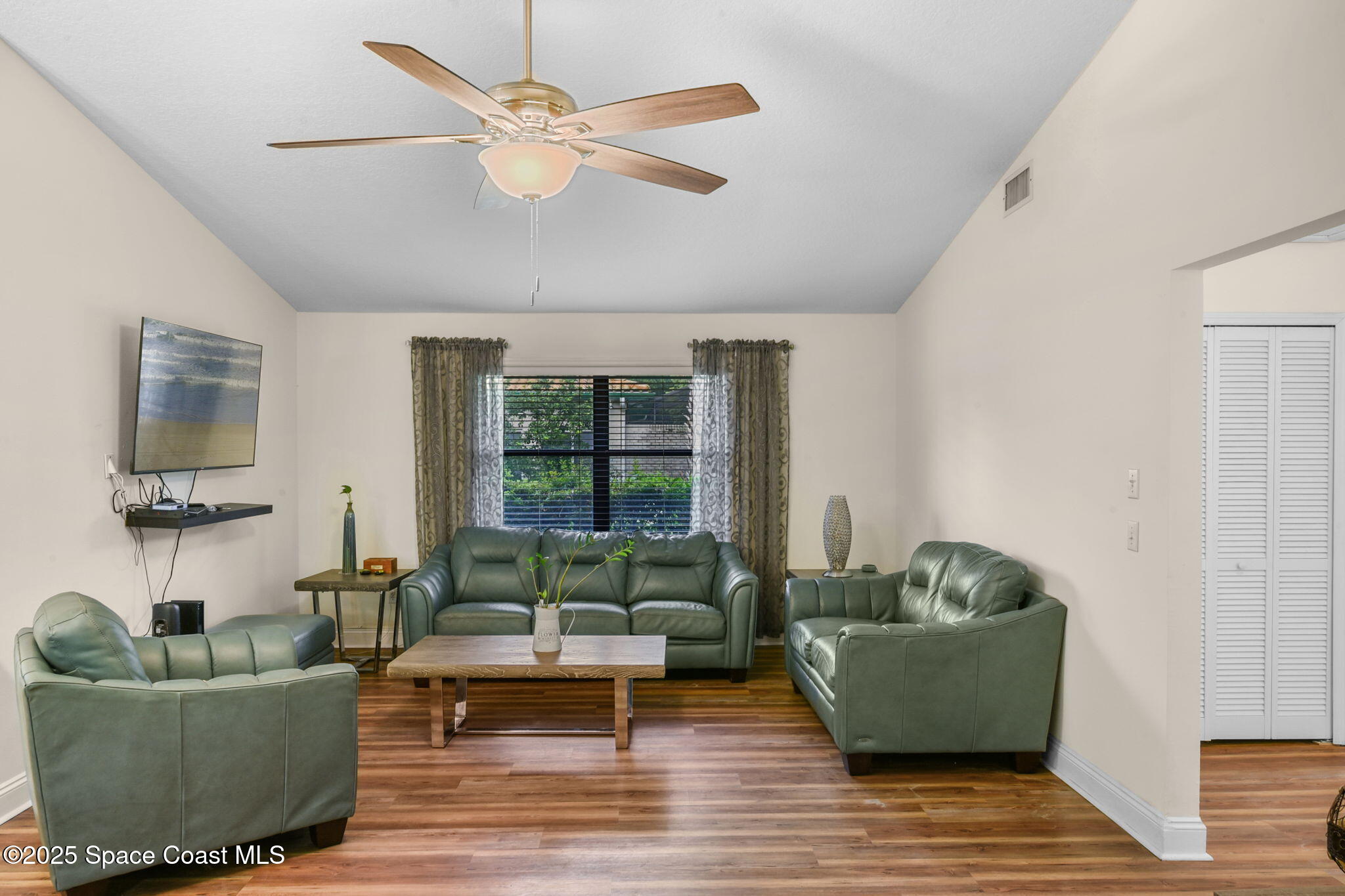 1873 Carrin Street Deltona, FL 32738 - Photo 13 of 54 a living room with furniture and a large window