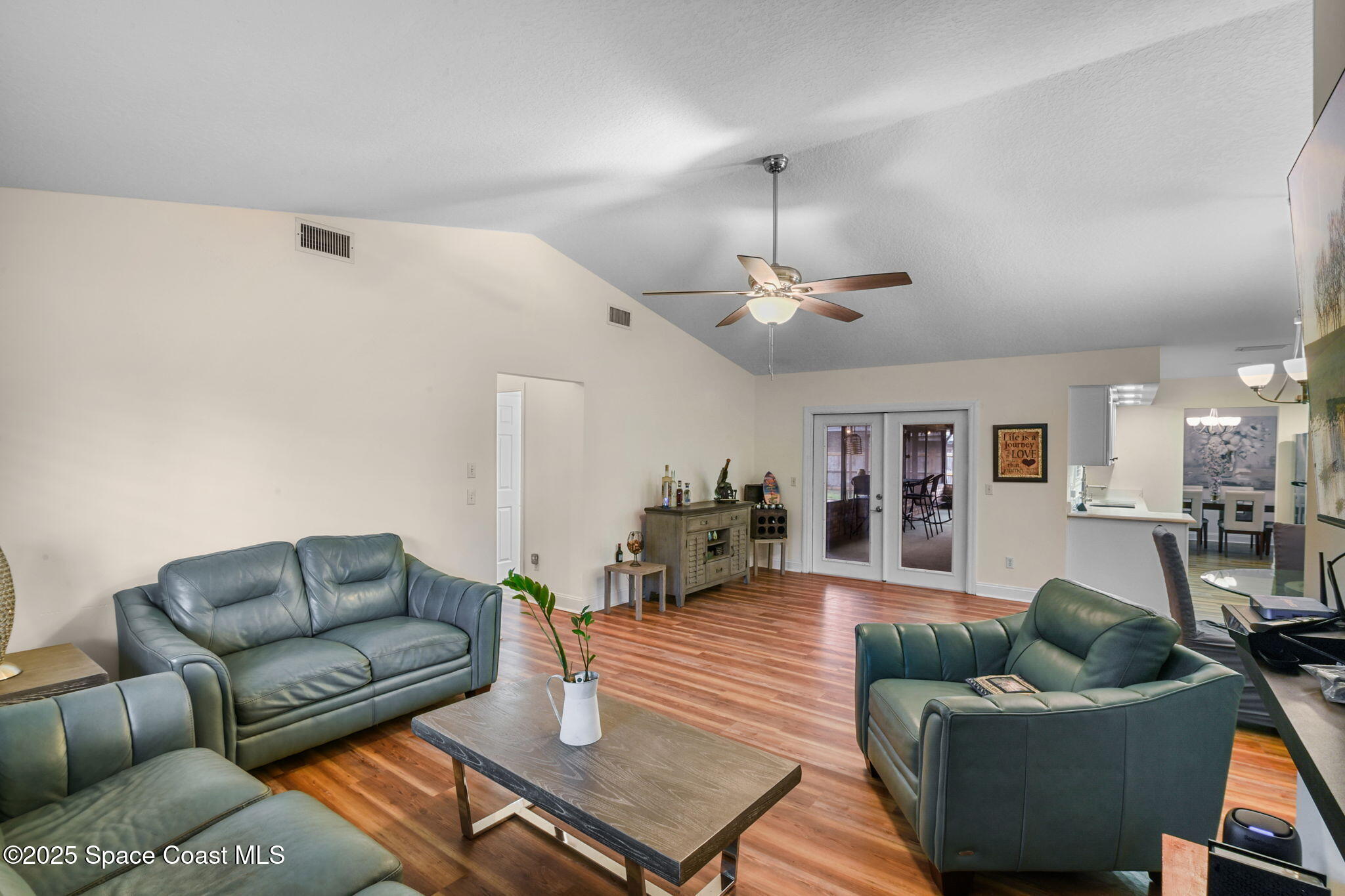 1873 Carrin Street Deltona, FL 32738 - Photo 14 of 54 a living room with furniture and a wooden floor