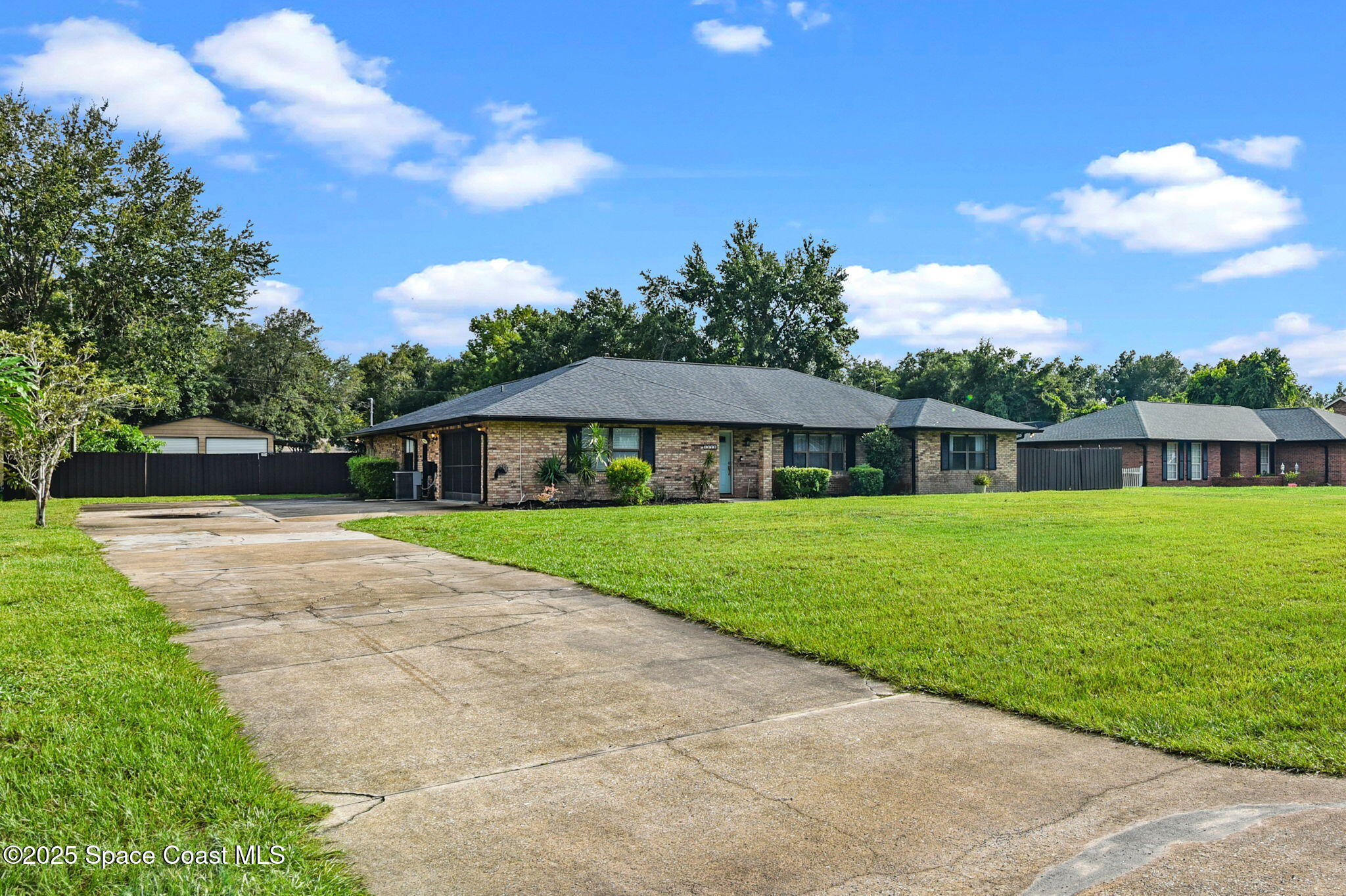 1873 Carrin Street Deltona, FL 32738 - Photo 2 of 54 a view of an house with backyard space and garden