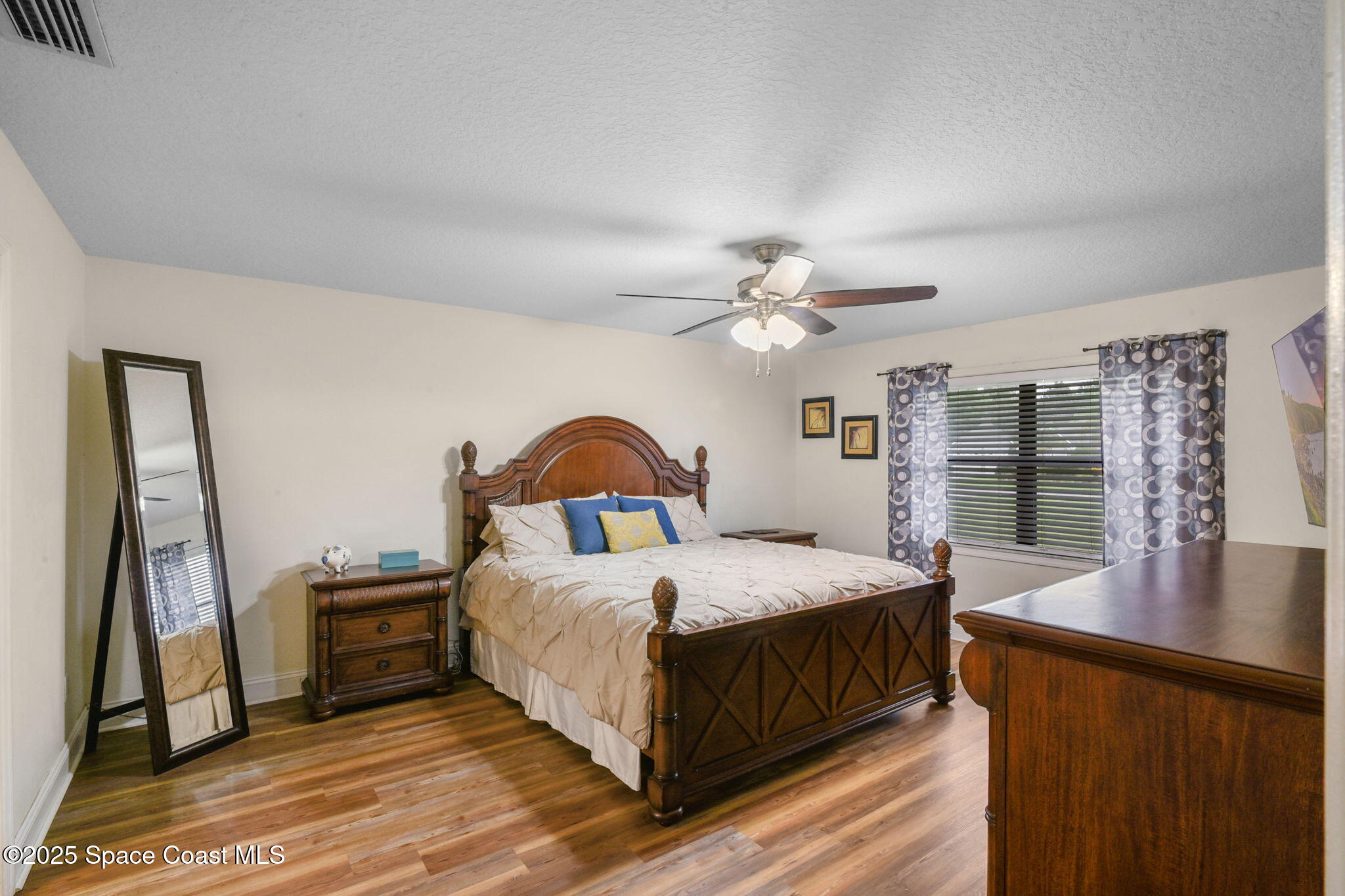 1873 Carrin Street Deltona, FL 32738 - Photo 22 of 54 a bedroom with a bed and a large window