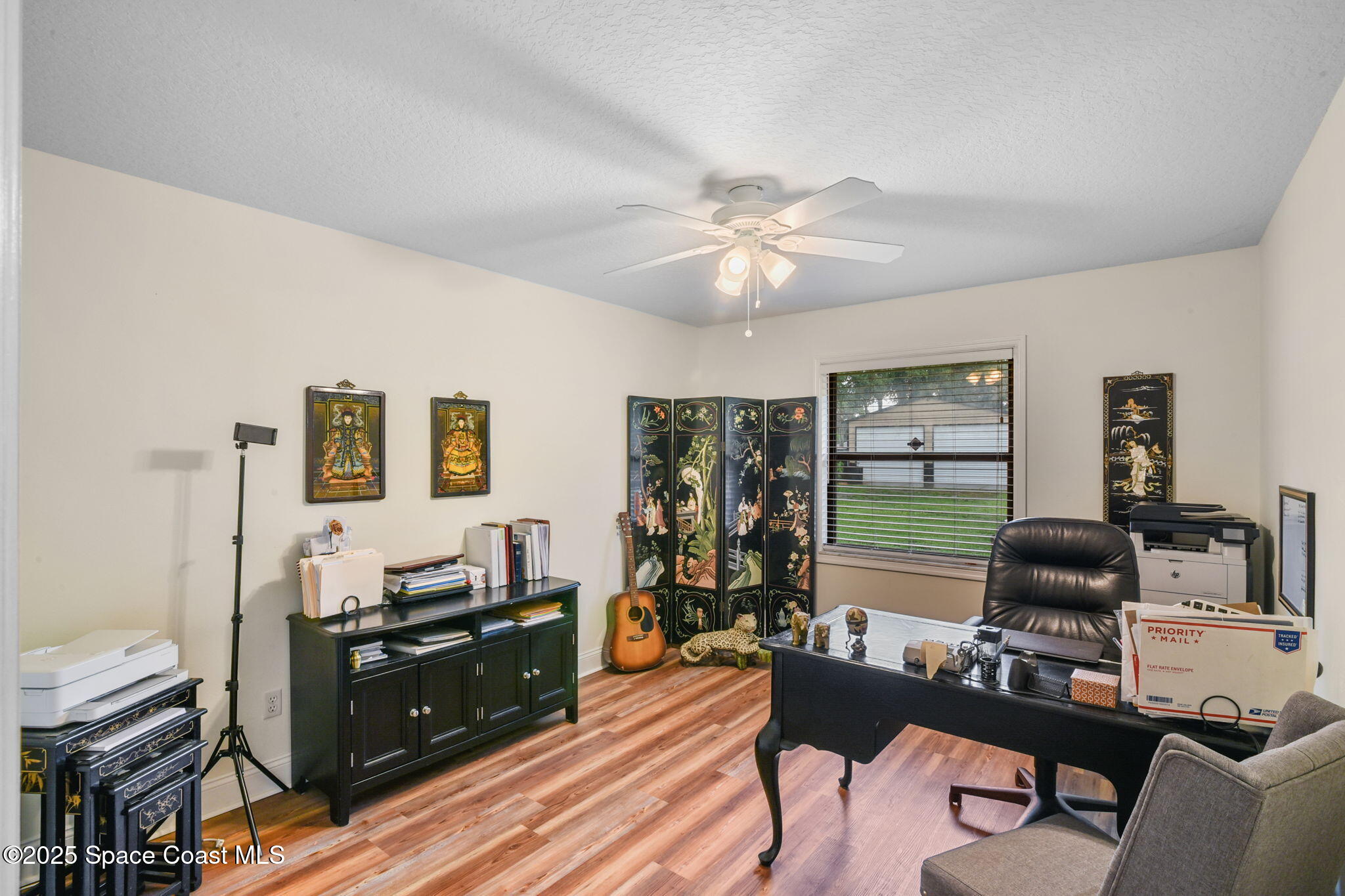 1873 Carrin Street Deltona, FL 32738 - Photo 25 of 54 a living room with furniture and a flat screen tv