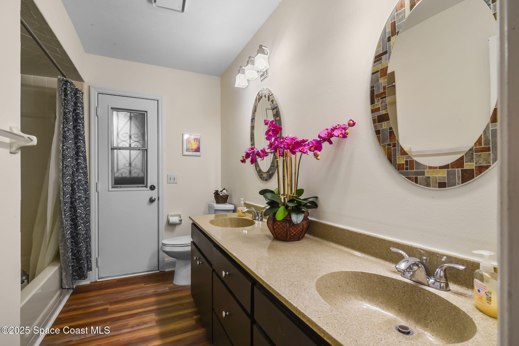 1873 Carrin Street Deltona, FL 32738 - Photo 26 of 54 a bathroom with a sink vanity and a mirror