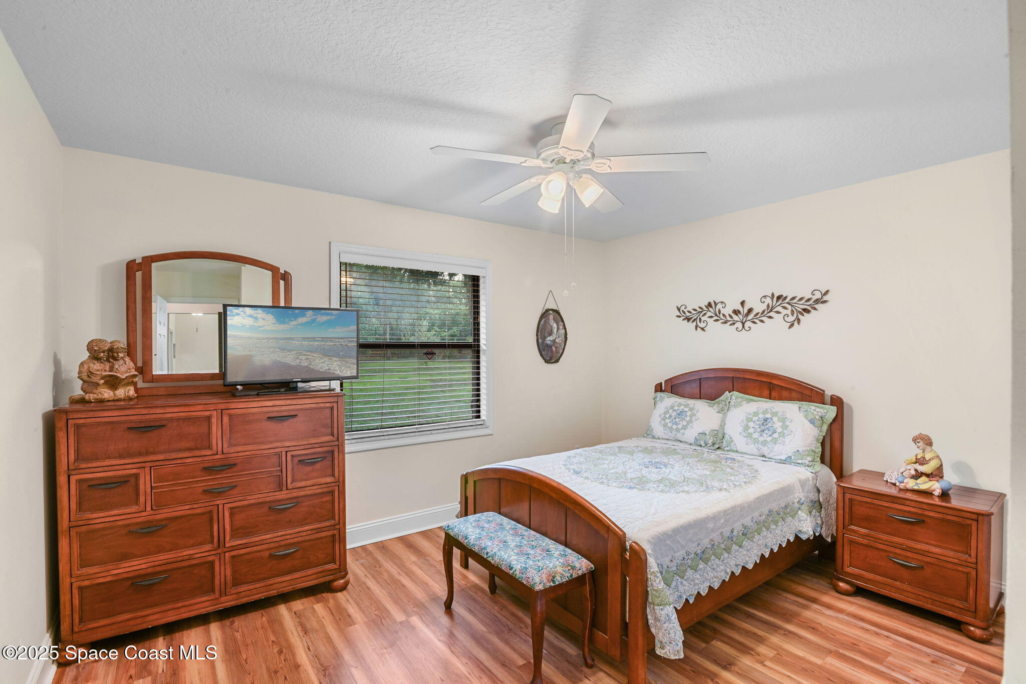 1873 Carrin Street Deltona, FL 32738 - Photo 27 of 54 a bedroom with a bed and a dresser