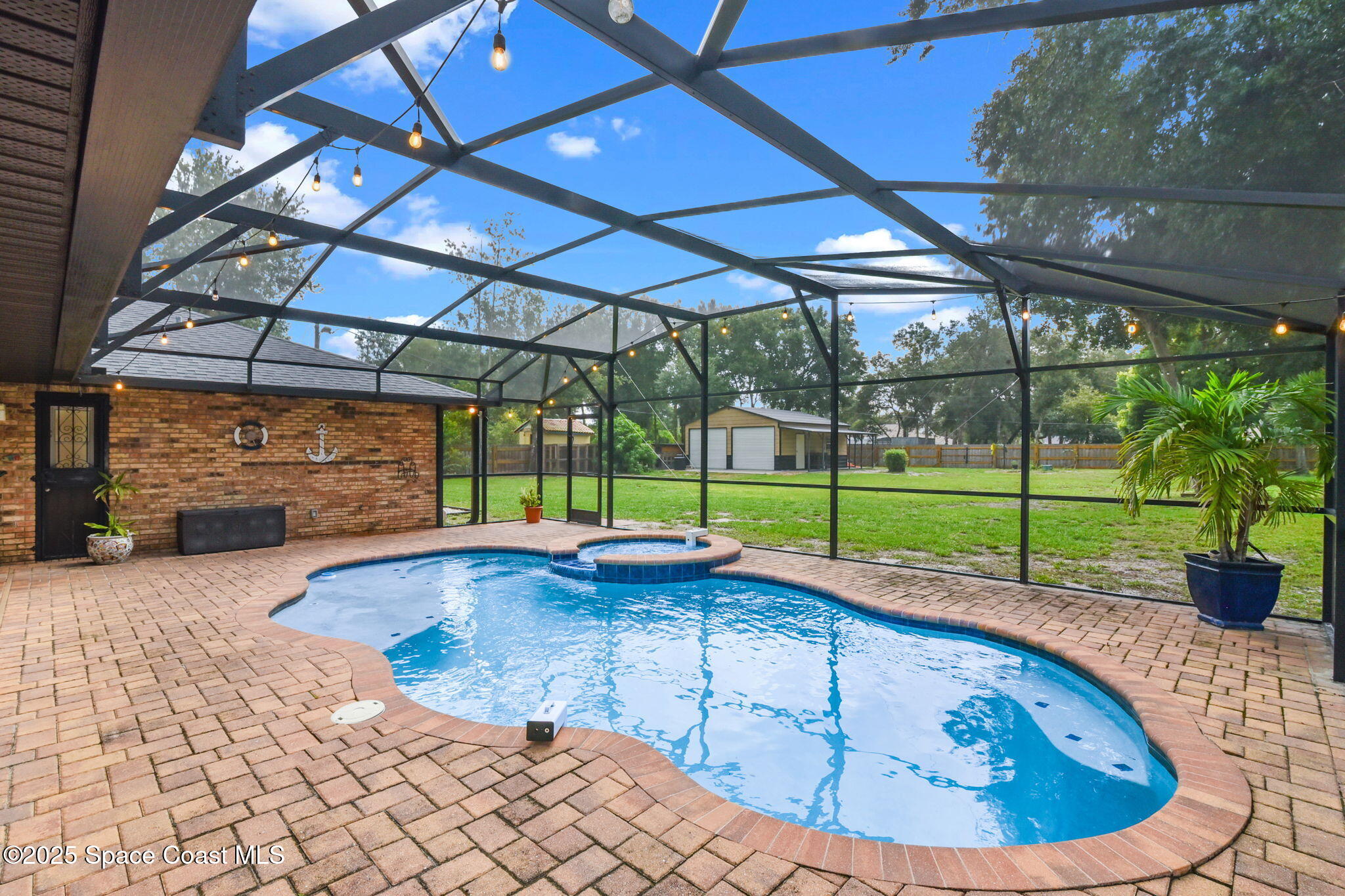 1873 Carrin Street Deltona, FL 32738 - Photo 32 of 54 a view of a backyard with sitting area