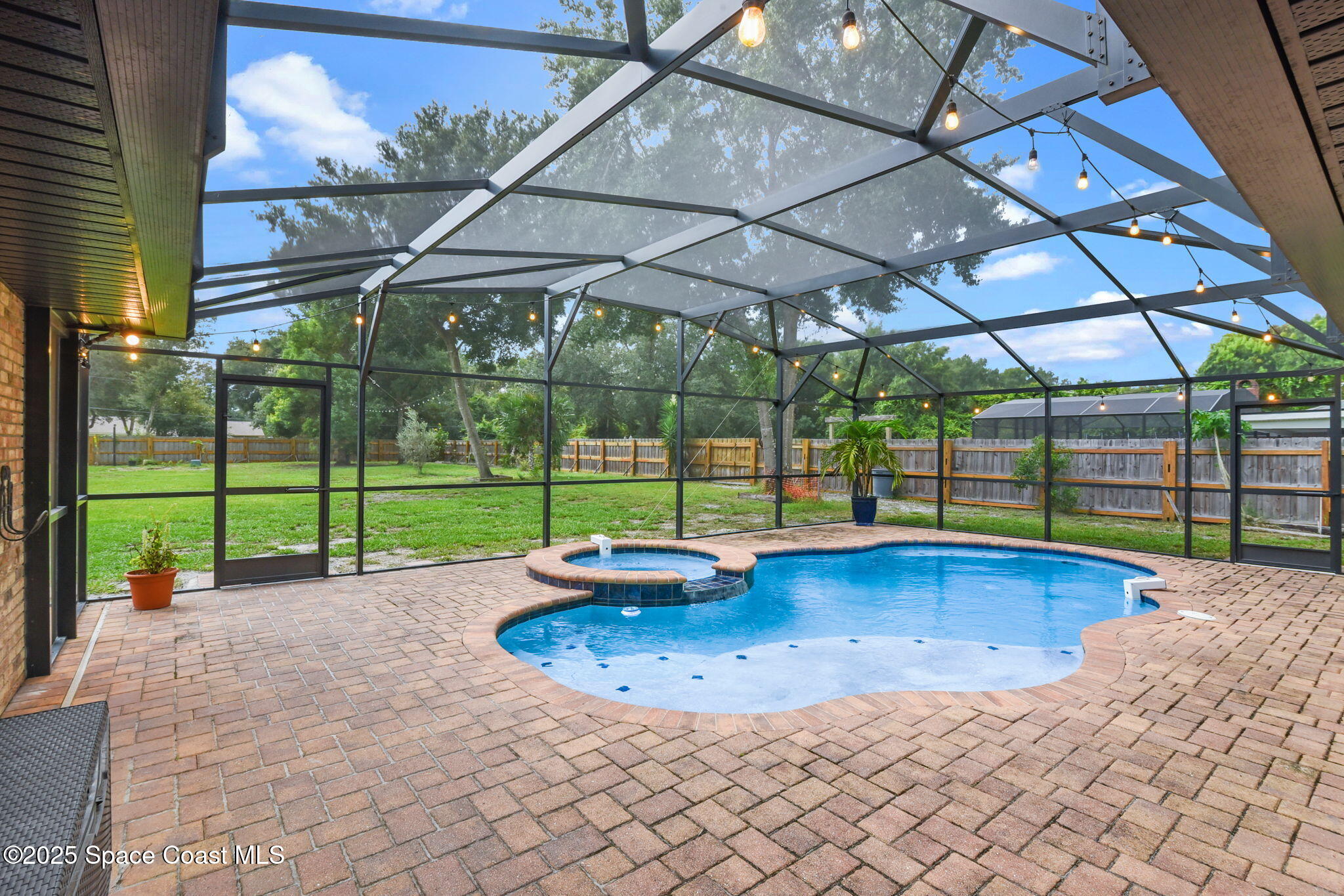 1873 Carrin Street Deltona, FL 32738 - Photo 33 of 54 a view of a backyard with a swimming pool