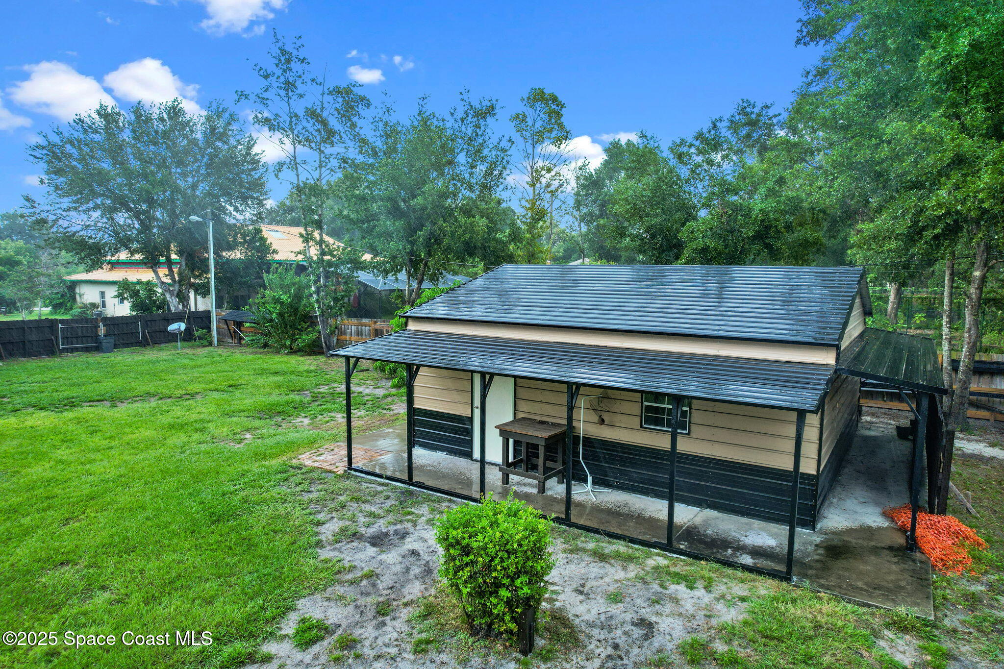 1873 Carrin Street Deltona, FL 32738 - Photo 43 of 54 a view of a wooden bench sitting in the garden