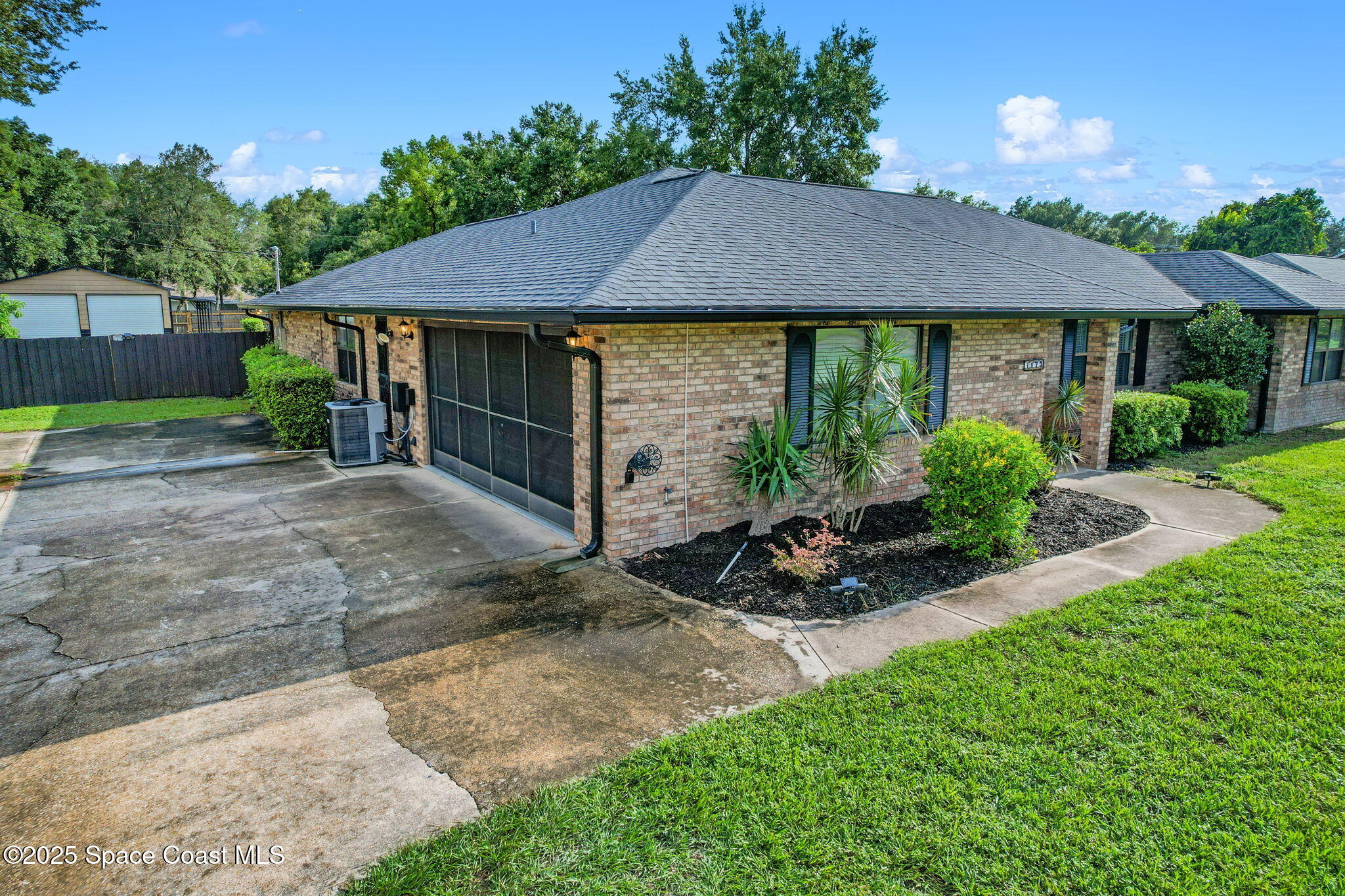1873 Carrin Street Deltona, FL 32738 - Photo 44 of 54 a view of a house with garden and plants