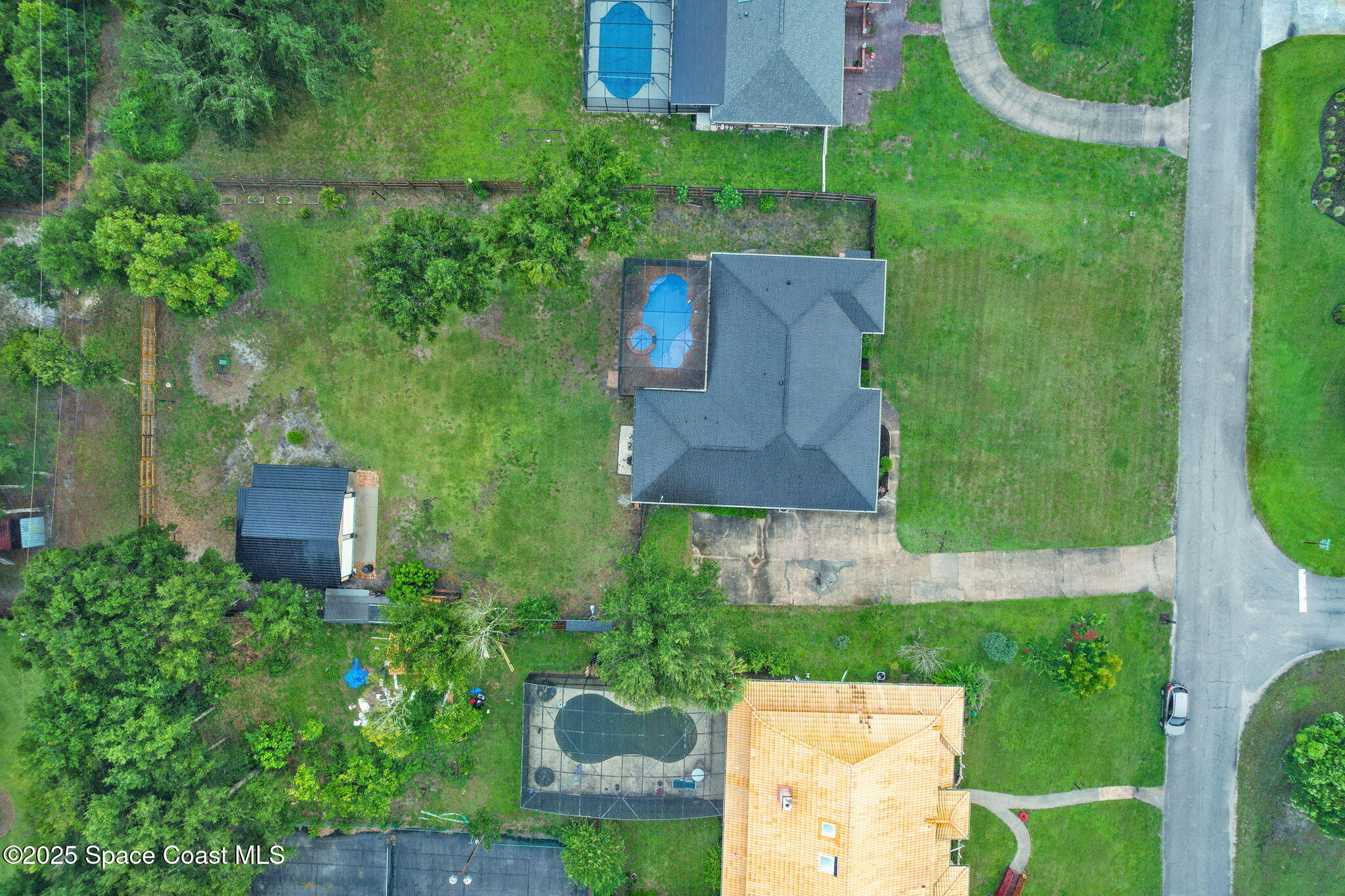 1873 Carrin Street Deltona, FL 32738 - Photo 47 of 54 an aerial view of a house with a garden