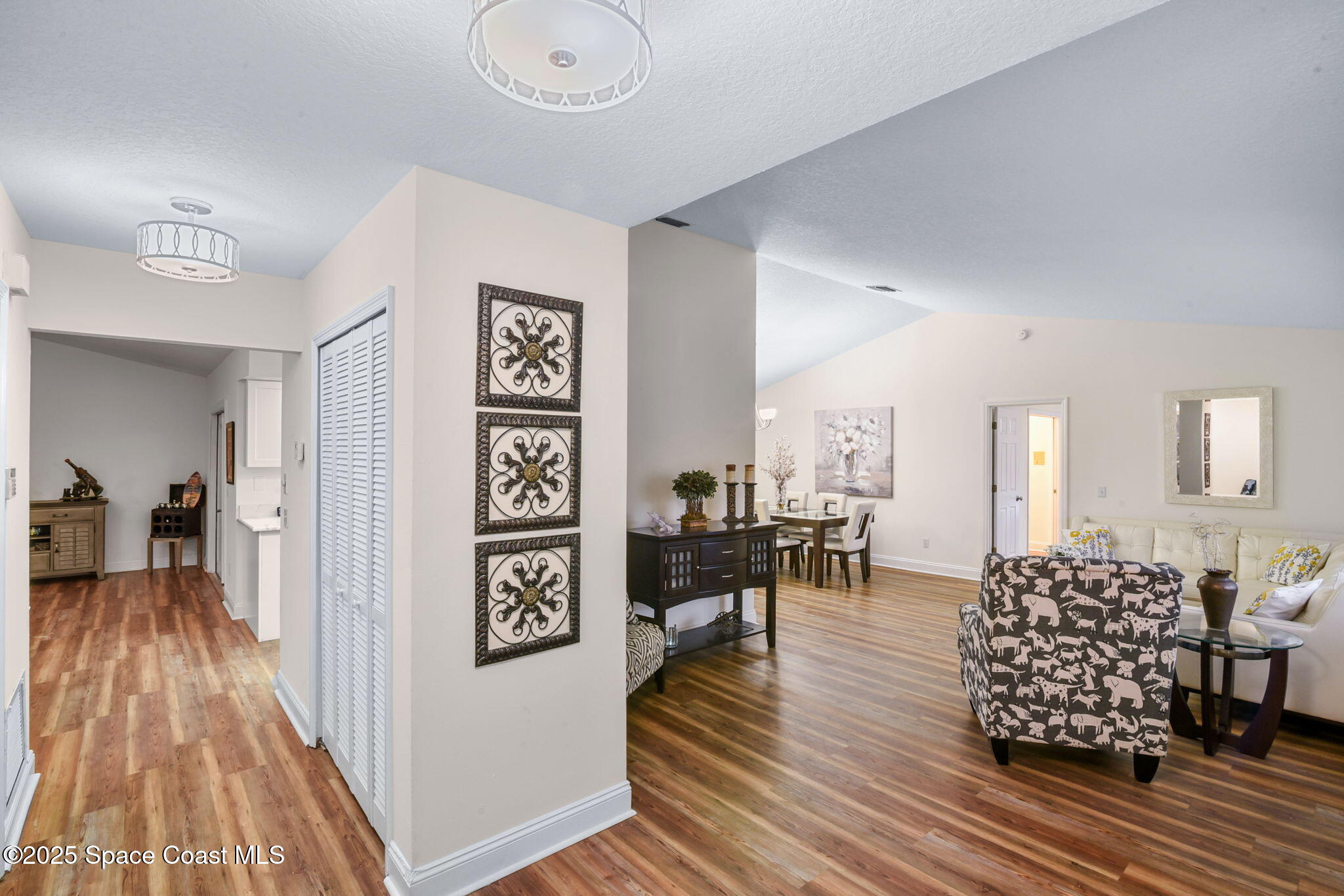 1873 Carrin Street Deltona, FL 32738 - Photo 6 of 54 a living room with furniture and a wooden floor