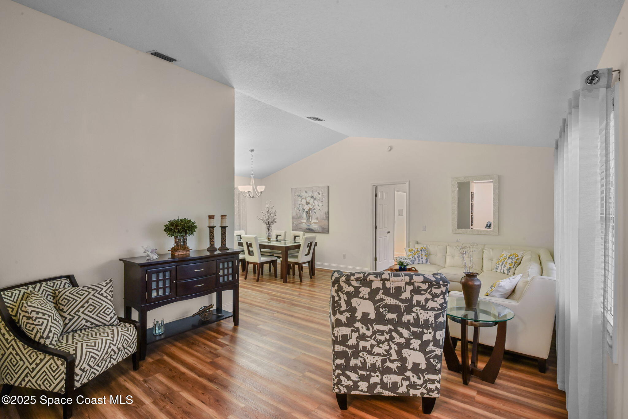 1873 Carrin Street Deltona, FL 32738 - Photo 7 of 54 a living room with furniture and wooden floor