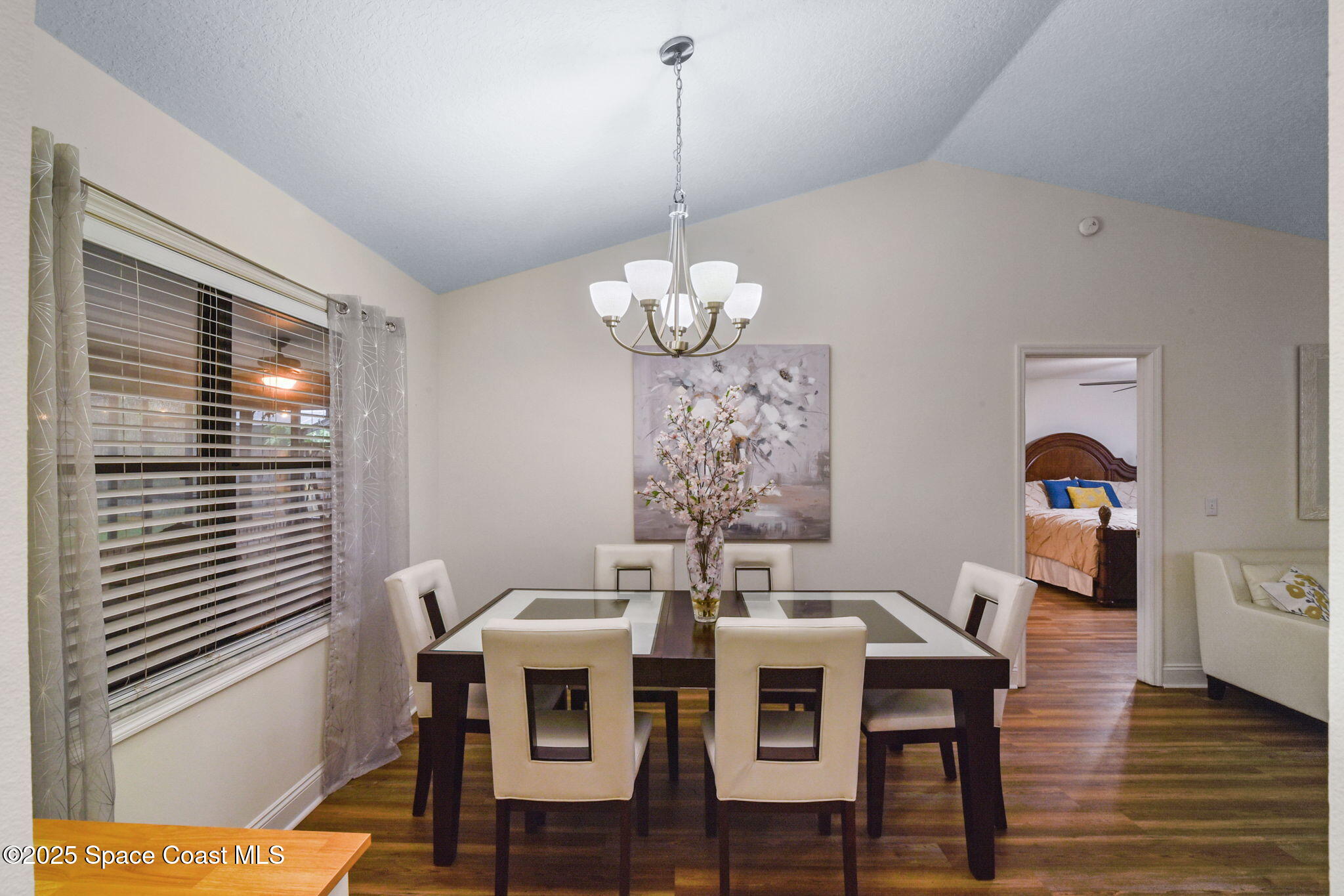 1873 Carrin Street Deltona, FL 32738 - Photo 9 of 54 a dining room with furniture and wooden floor