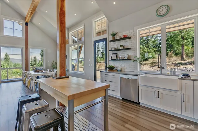 a kitchen with a stove a sink and a refrigerator