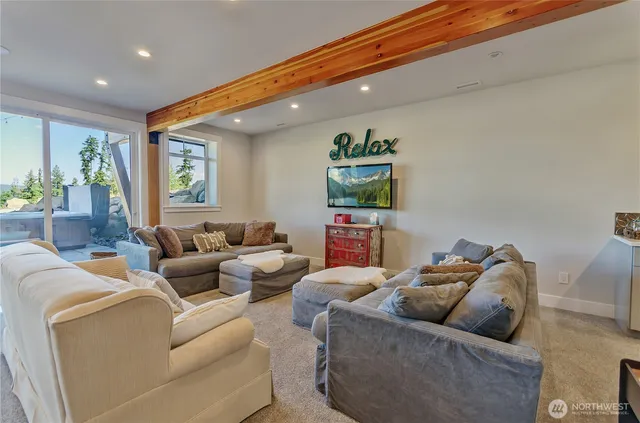 a living room with furniture and a rug