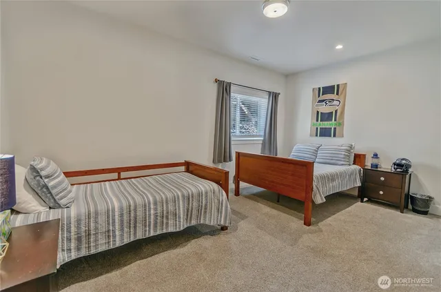 a bedroom with a bed and window