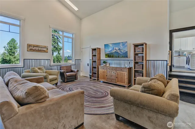 a living room with furniture and a window