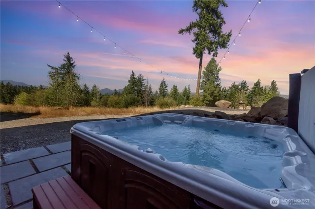 a view of outdoor space with swimming pool and seating
