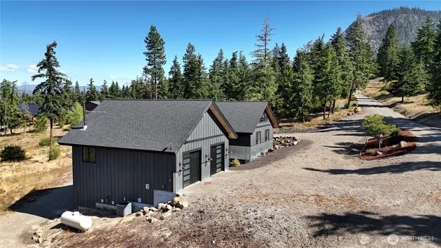 a view of house with backyard space and sitting area