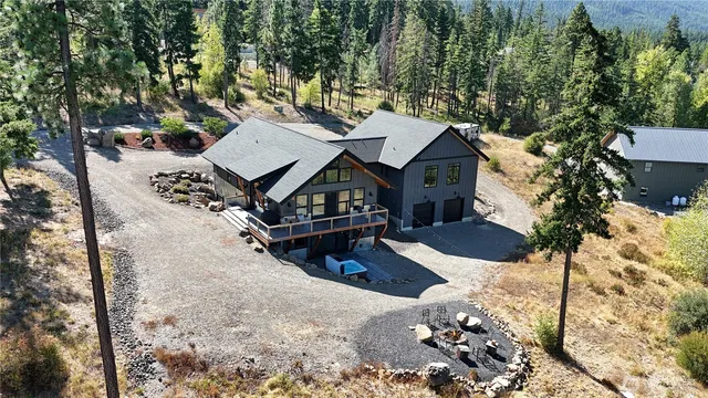 an aerial view of a house with a yard covered in snow