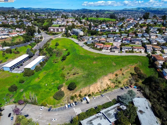 an aerial view of a houses with a yard