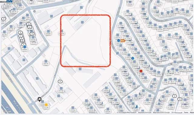 an aerial view of a house with a garden and lake view