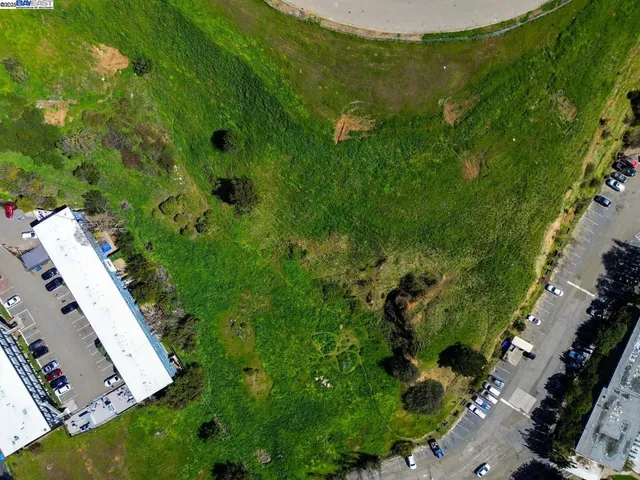 an aerial view of a residential houses with outdoor space