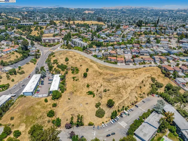 a view of a road with a building in the background