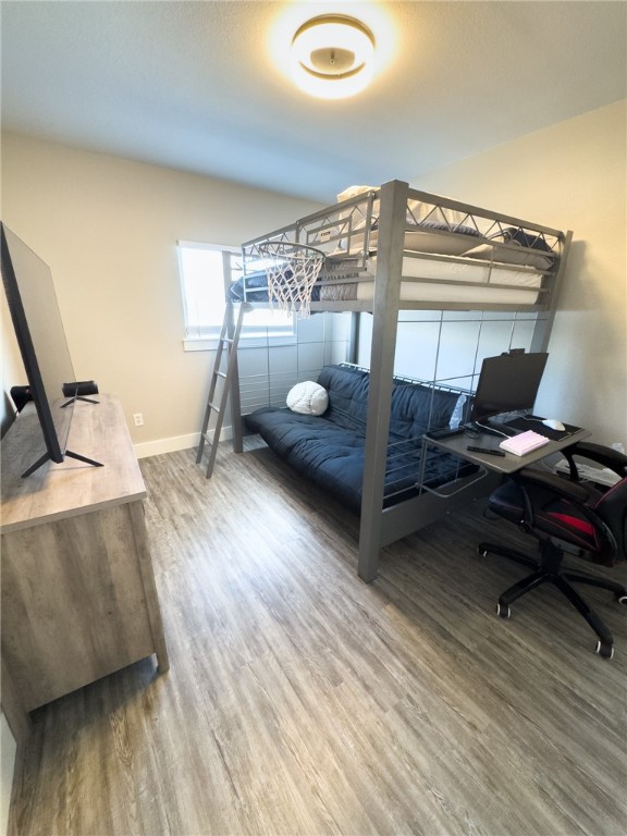 14439 Compass Street, Unit B Corpus Christi, TX 78418 - Photo 15 of 22 a workspace with furniture and wooden floor