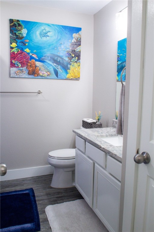 14439 Compass Street, Unit B Corpus Christi, TX 78418 - Photo 16 of 22 a bathroom with a toilet and a sink