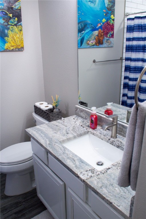 14439 Compass Street, Unit B Corpus Christi, TX 78418 - Photo 17 of 22 a bathroom with a granite countertop sink and a mirror