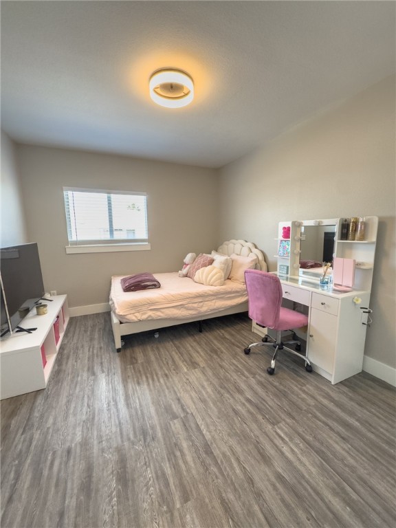 14439 Compass Street, Unit B Corpus Christi, TX 78418 - Photo 18 of 22 a bedroom with a bed and a desk