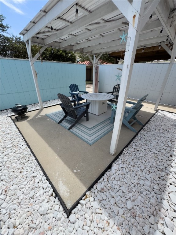 14439 Compass Street, Unit B Corpus Christi, TX 78418 - Photo 2 of 22 a view of a backyard with table and chairs