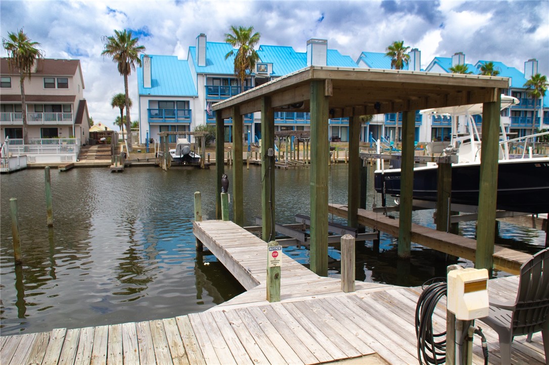 14439 Compass Street, Unit B Corpus Christi, TX 78418 - Photo 21 of 22 a view of a lake from a balcony