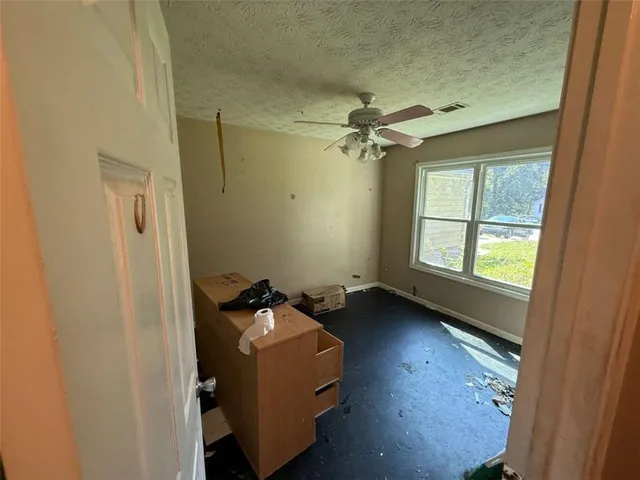 wooden floor in an empty room and a window