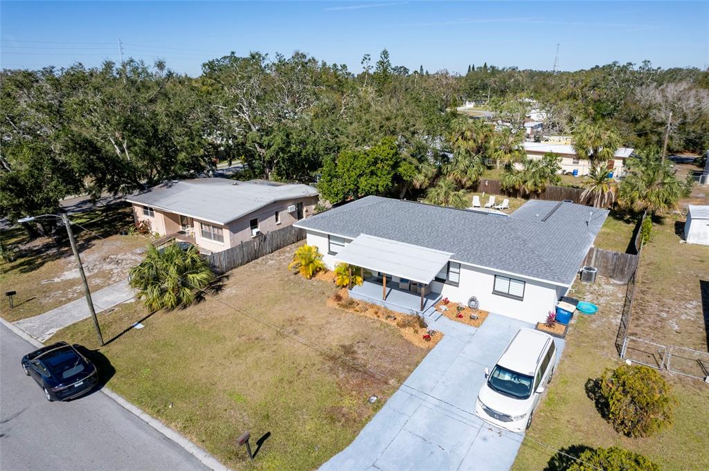 an aerial view of a house with outdoor space