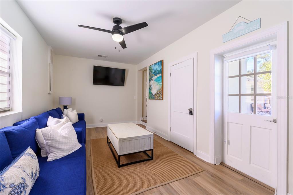 1344 Springdale Street Clearwater, FL 33755 - Photo 21 of 34 a living room with furniture and a flat screen tv