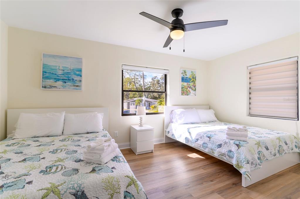 1344 Springdale Street Clearwater, FL 33755 - Photo 22 of 34 a bedroom with a large bed and a window