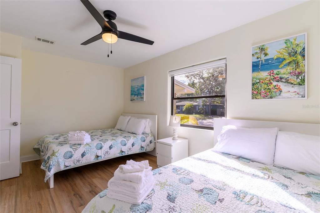 1344 Springdale Street Clearwater, FL 33755 - Photo 23 of 34 a bedroom with a bed and a large window